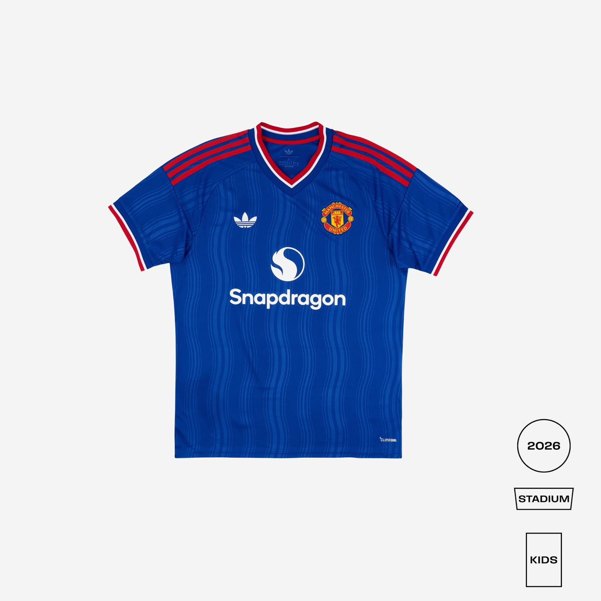 A blue Manchester United soccer jersey by Adidas, featuring red and white trim on the V-neck and sleeve cuffs, with the Snapdragon sponsor logo on the chest. The image is set against a light gray background with size and style indicators in the bottom right corner.