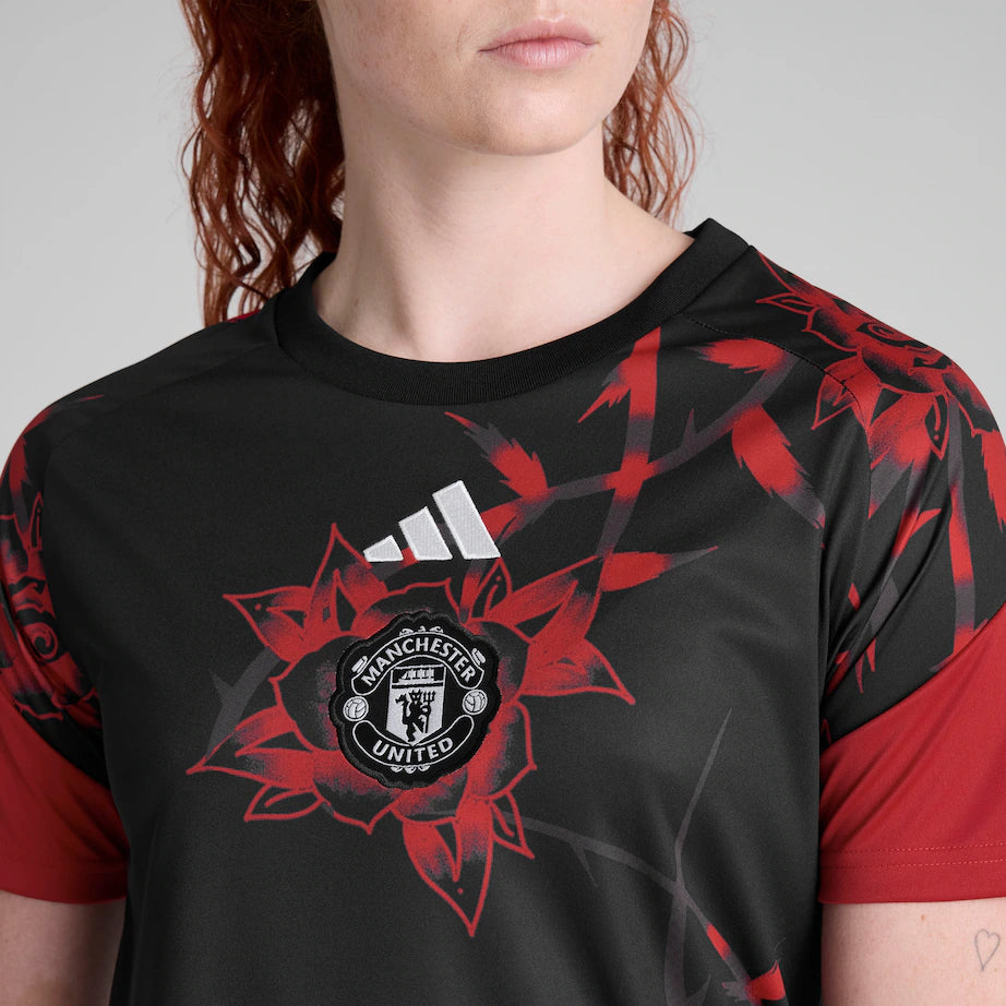 Manchester United 2026/27 pre match shirt, red and white, front view up close on model