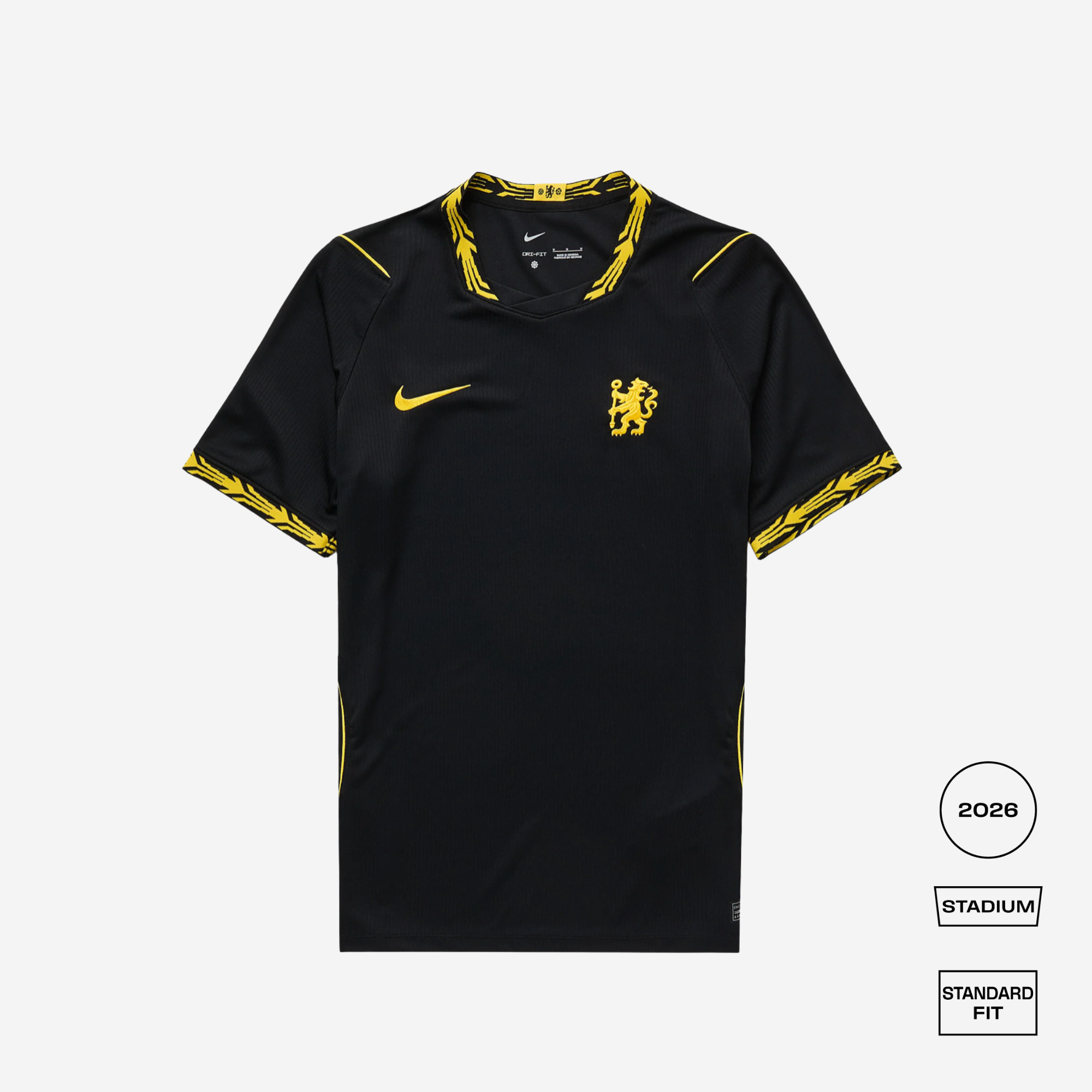 A black Nike Chelsea FC home soccer jersey with yellow accents, featuring the club's crest on the chest, a yellow Nike swoosh, and yellow patterned trim on the collar and sleeves, shown against a light gray background with fit and season labels.