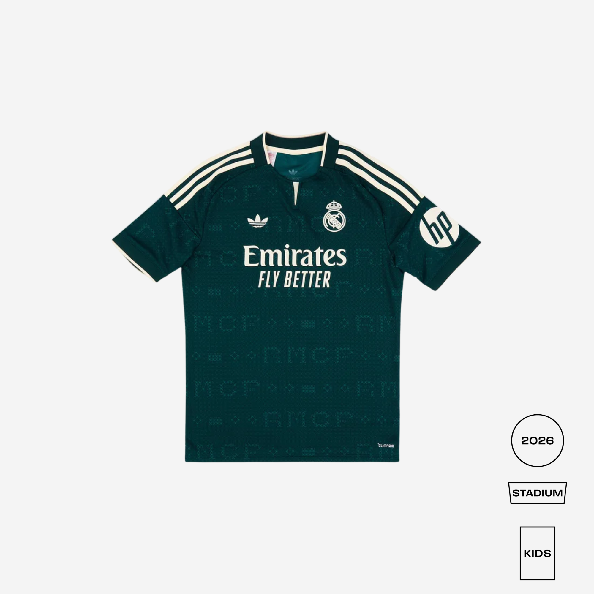 A dark green Real Madrid home soccer jersey with white accents, featuring the Adidas logo, Real Madrid crest, and Emirates Fly Better sponsor text. The jersey is displayed flat against a light gray background with size and style labels on the bottom right.