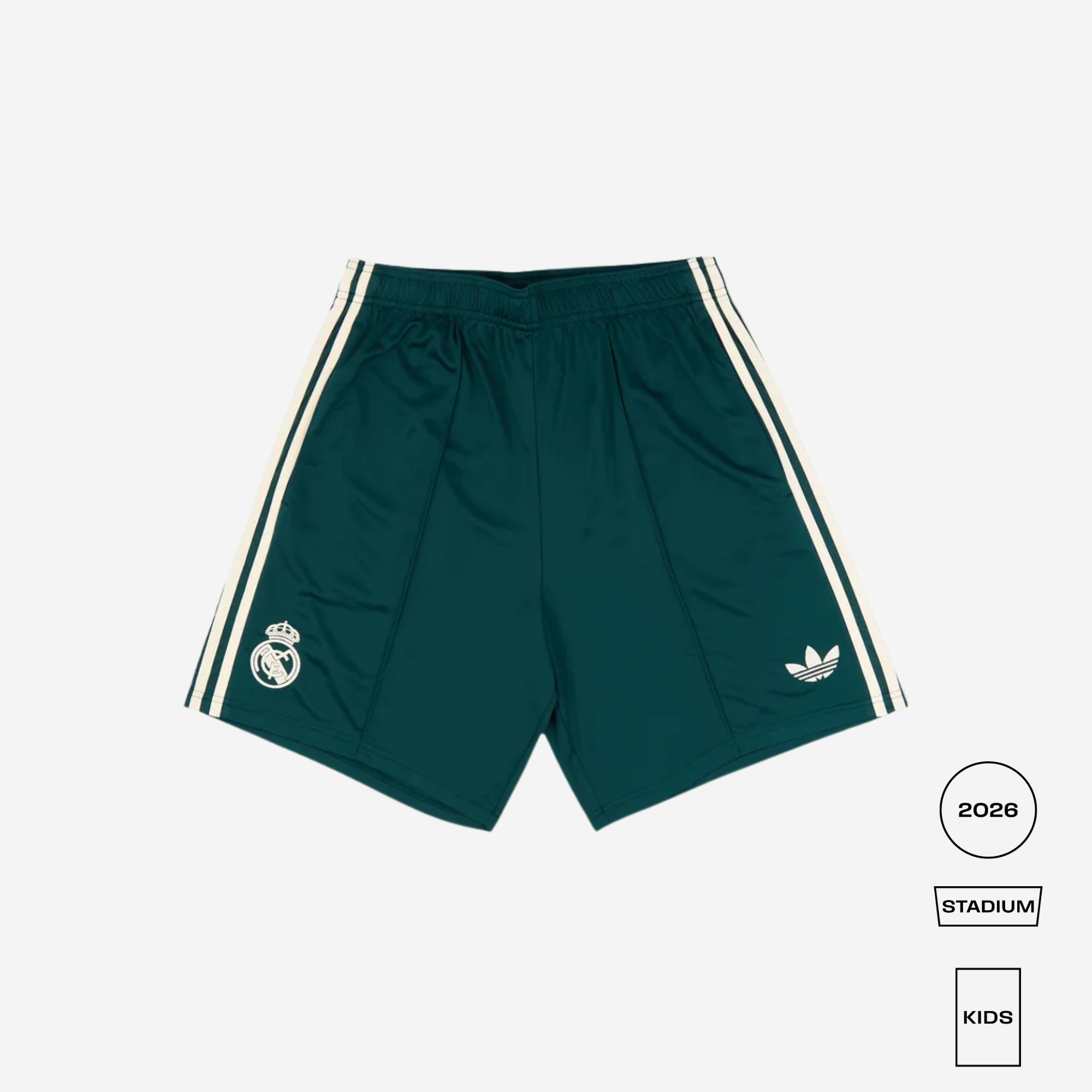 Dark green Real Madrid athletic shorts with white stripes and logos, shown flat on a light gray background with product details in the bottom right corner.